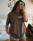 CTC approved original | pixels:81fecbc8d3900b6dfd918303f11405699966836fa6062a7773e7f52dd74860fe | Break Bread Tee | source:BreakBread Front Brown- Girl-Mirror selfie.png | side:front