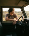 Man wearing Proverbs 16:3 tee in vintage truck - CarryTheCross