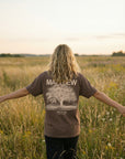 Woman wearing Matthew 5:3 Beatitudes tee in open field - CarryTheCross Christian tees