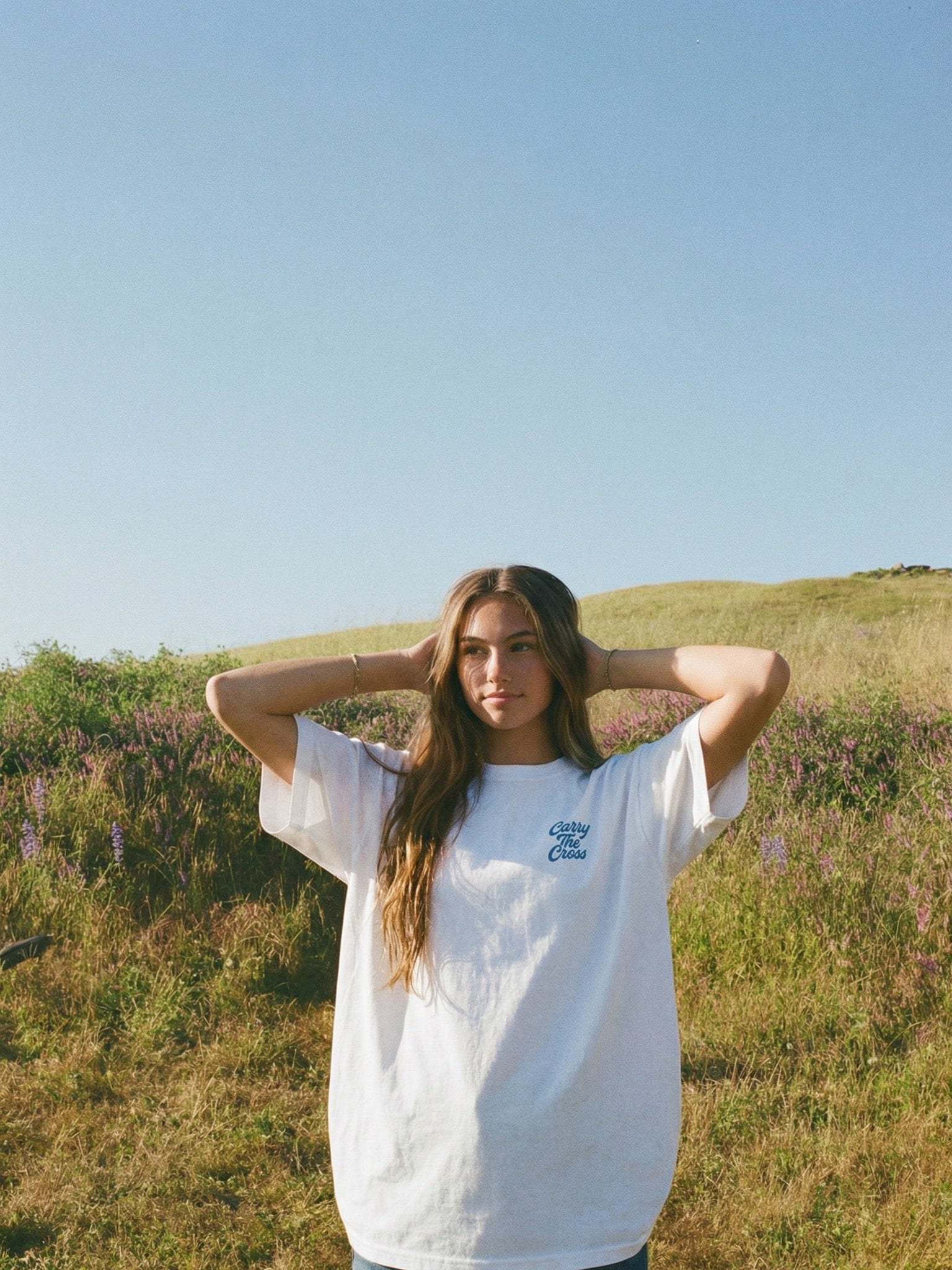 CTC approved original | pixels:c170c992030dbfb014270f4ed61a35a83765f6094fb1cf4d7bd7a20b9d732e84 | Faith Driven Tee | source:beach_faith_driven_hillside-front.jpeg | side:front