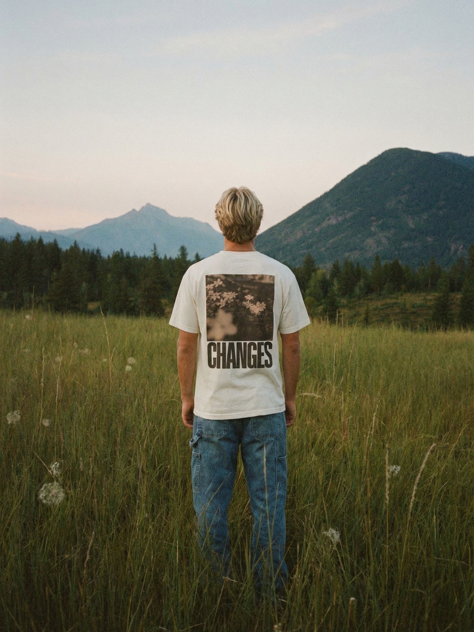 CTC approved original | pixels:83227120496a95298cc5538d2ffd4b232cf2a57cf3fded1dd069748e0428a900 | Changes Tee | source:blondeguy_changes-tee_mountain-back.jpeg | side:back