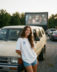 Woman wearing Faith Driven tee at drive-in - CarryTheCross Christian streetwear
