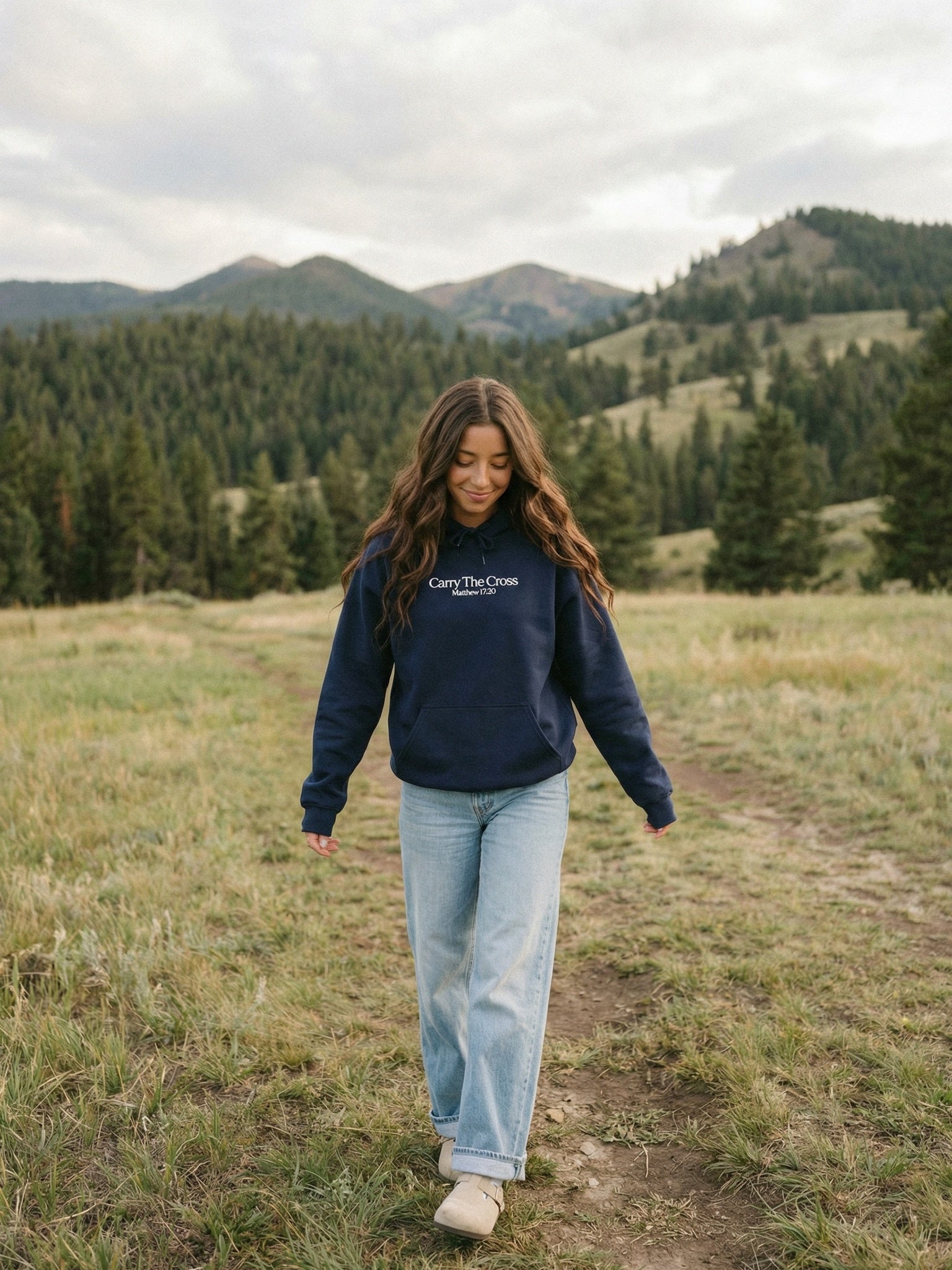 CTC approved original | pixels:ed3b9a99f68d3b35be18bee29f1497dbde2b1f4bcfe4c5cea139e7ccd8d04b07 | Matthew 17:20 Hoodie | source:brunette_matthew-1720-hoodie_mountain-walk.jpeg | side:front