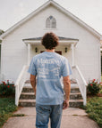 Man wearing Matthew 17:20 tee in front of church - CarryTheCross