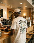 Man wearing Break tee at coffee counter - CarryTheCross Christian streetwear
