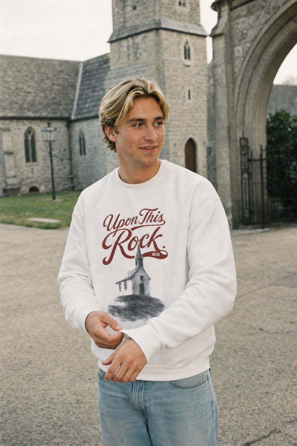 Man wearing the white Upon This Rock Christian crewneck outdoors, featuring the Matthew 16:18 front design | CarryTheCross